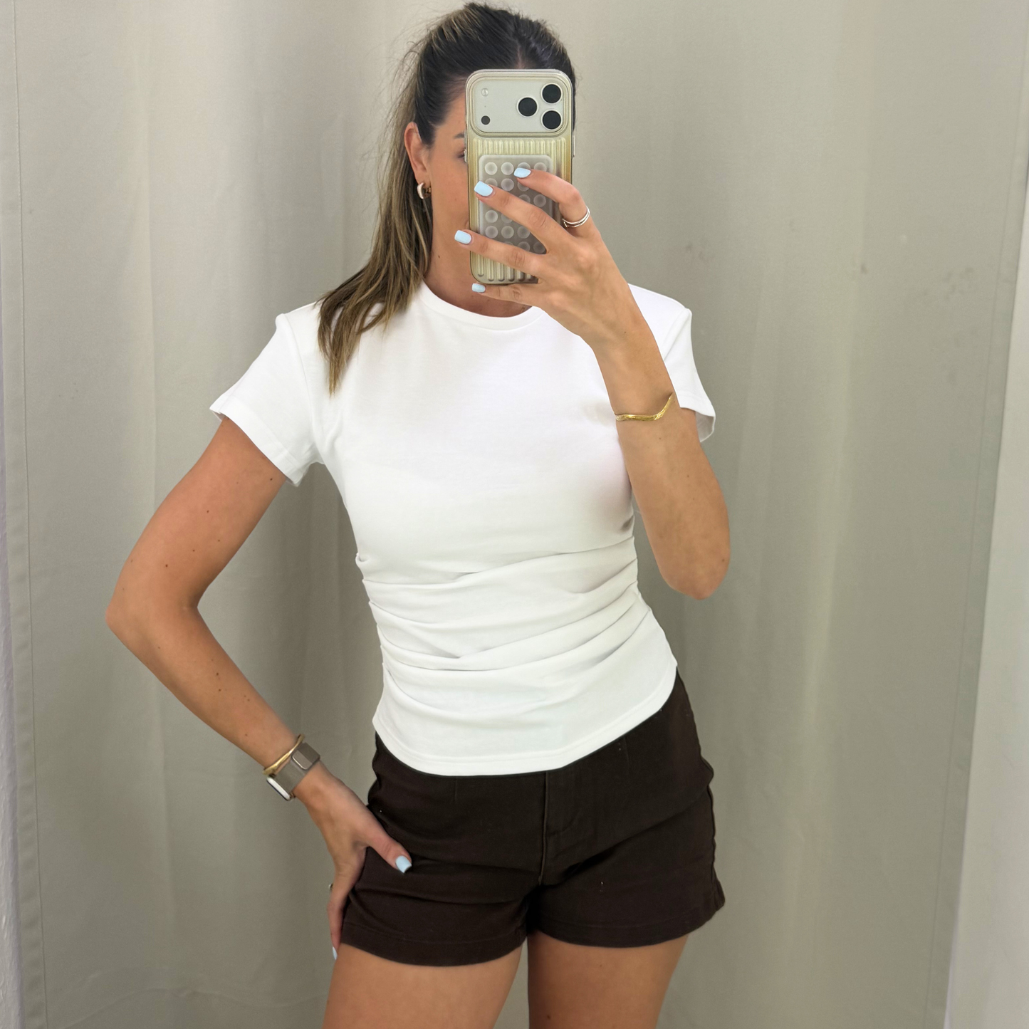 White shoulder padded top
