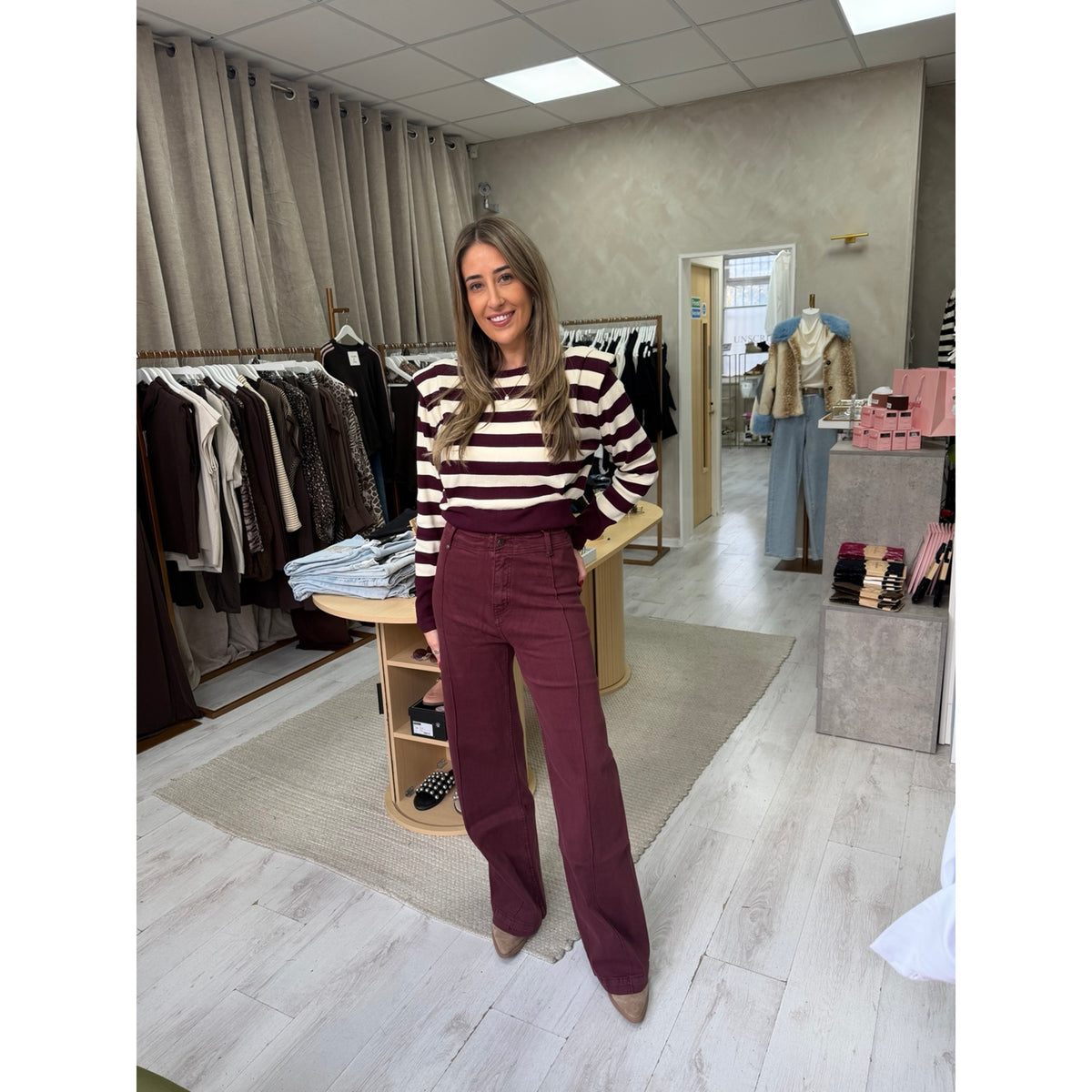 Burgundy and cream striped padded shoulder jumper worn in the Unscripted boutique