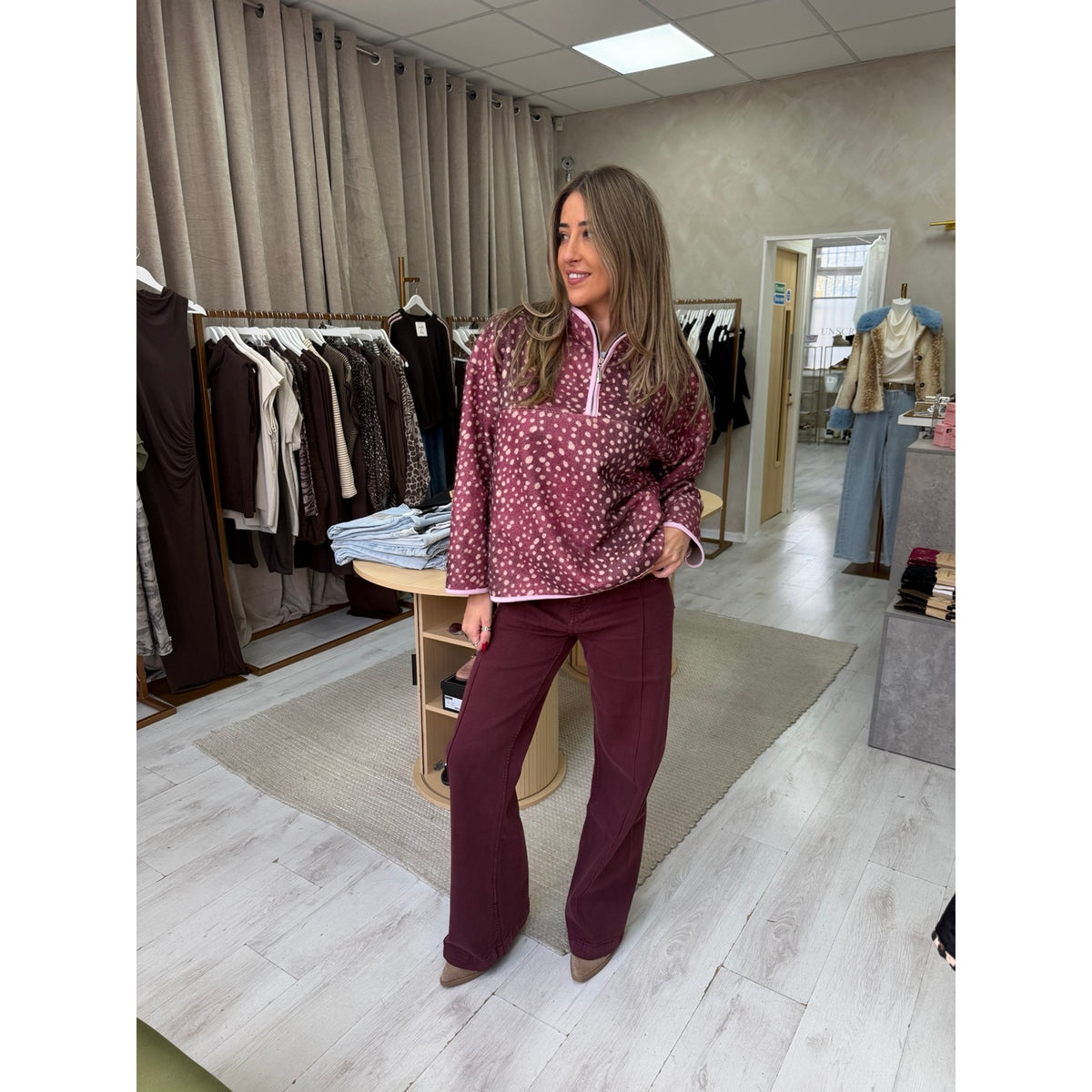 Burgundy Bambi fawn print half zip fleece worn in the Unscripted boutique