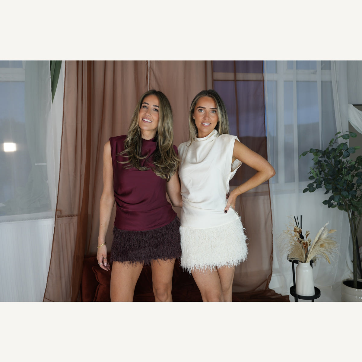 Cream and burgundy party outfits photographed together